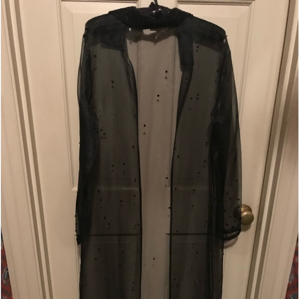 Ritmo di Perla sheer long robe or evening coat with beaded embellishments.